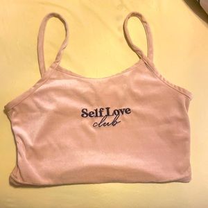 This is a crop top. It is light brown and a size medium